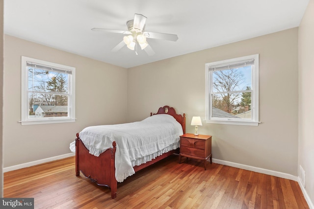 bedroom featuring hardwood / wood-style floors and ceiling fan