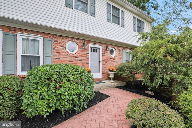 doorway to property featuring a patio