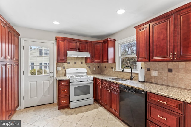 kitchen featuring dishwasher, sink, backsplash, white range with gas cooktop, and light stone countertops