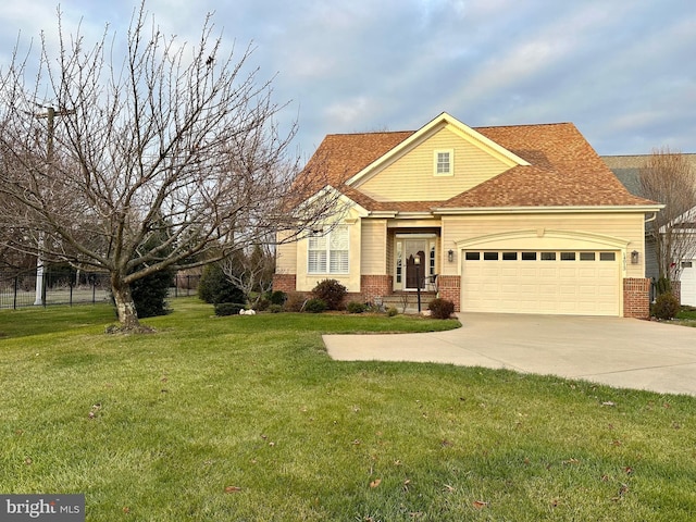 view of front of home featuring a garage and a front lawn