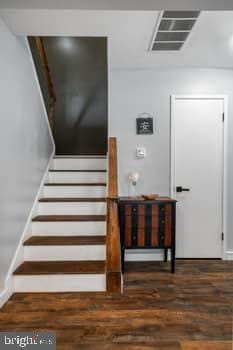 stairway featuring hardwood / wood-style flooring