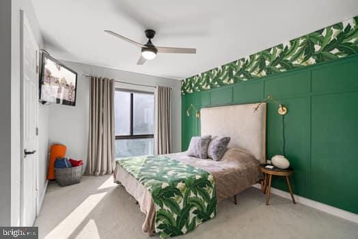 carpeted bedroom featuring ceiling fan