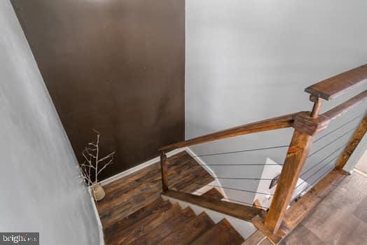 staircase featuring hardwood / wood-style floors