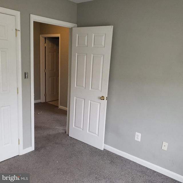 empty room with carpet flooring