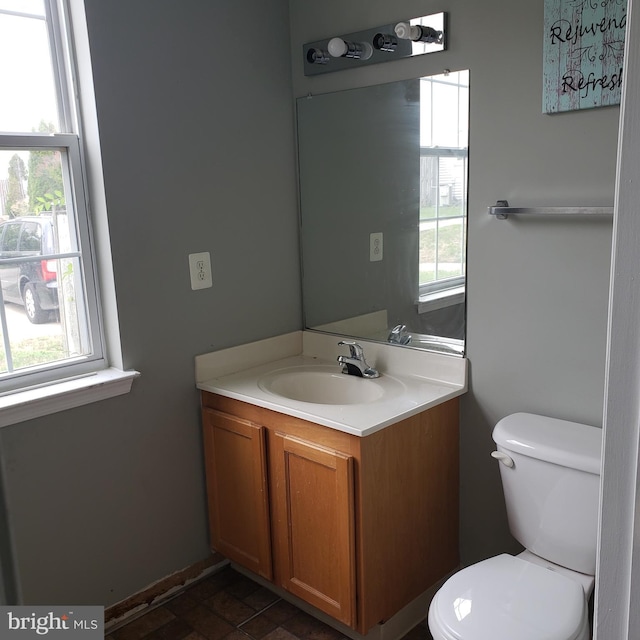 bathroom featuring vanity and toilet