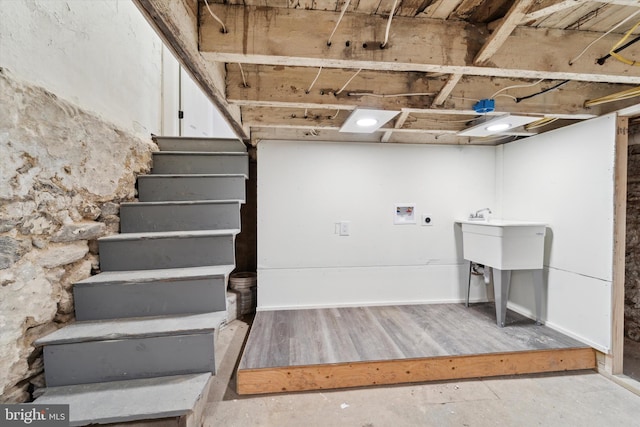 basement featuring light wood-type flooring