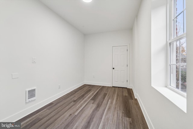 spare room featuring dark hardwood / wood-style floors