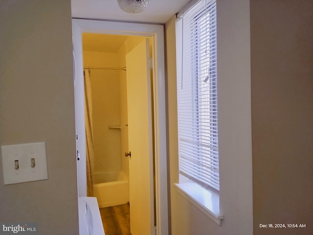 corridor featuring hardwood / wood-style floors