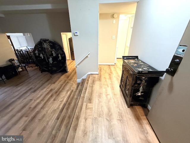 corridor featuring light hardwood / wood-style flooring