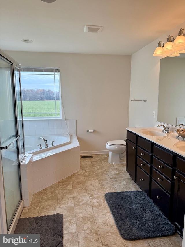 full bathroom with tile patterned floors, vanity, toilet, and separate shower and tub