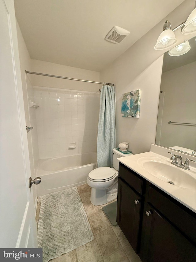 full bathroom featuring vanity, shower / bath combo, and toilet