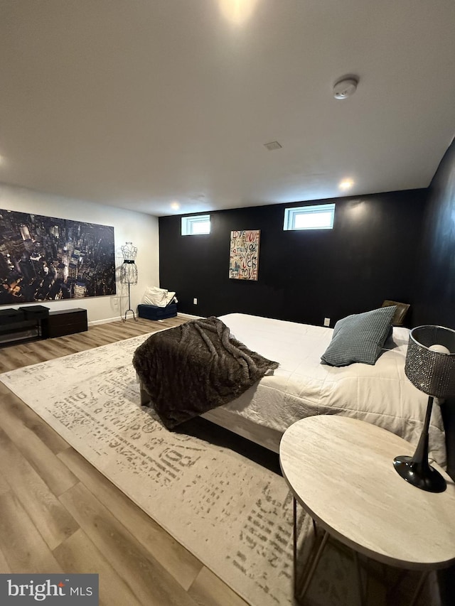 bedroom featuring wood-type flooring