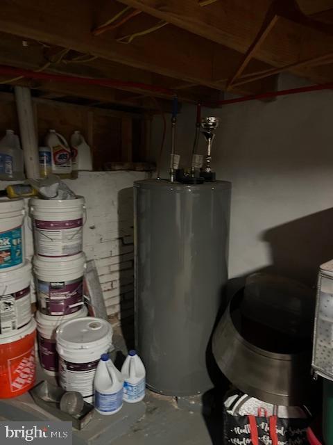 utility room with water heater