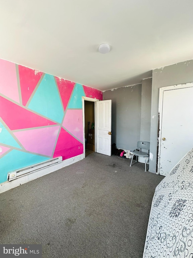 bedroom featuring carpet flooring and baseboard heating