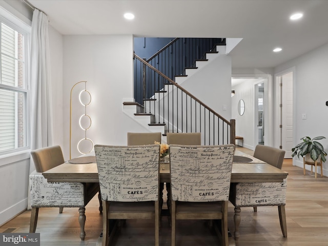 dining area with a healthy amount of sunlight and wood-type flooring