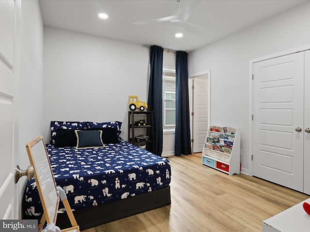 bedroom with hardwood / wood-style floors and ceiling fan