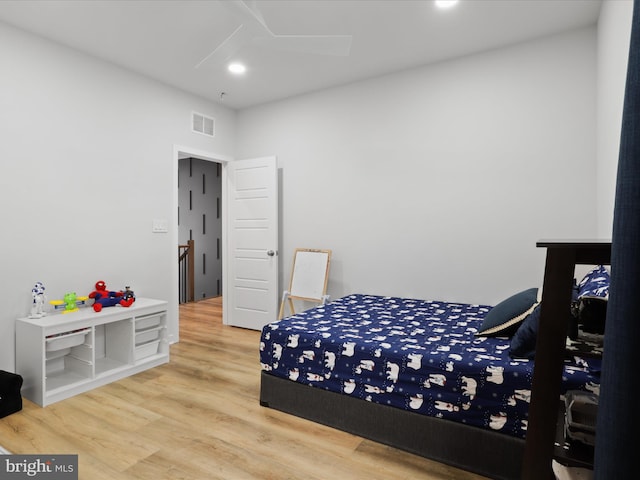 bedroom with hardwood / wood-style floors