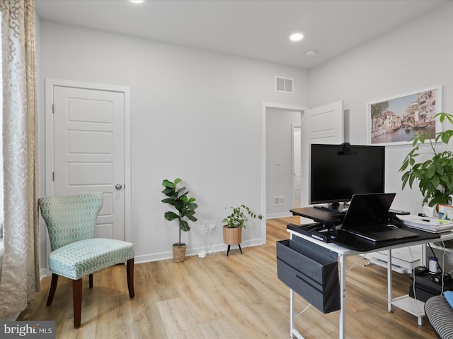 home office featuring light hardwood / wood-style flooring