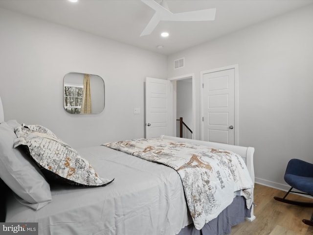 bedroom featuring ceiling fan and light hardwood / wood-style flooring