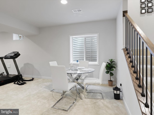 carpeted dining space featuring a wealth of natural light