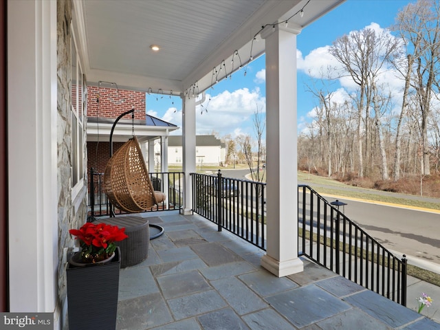 balcony featuring a porch