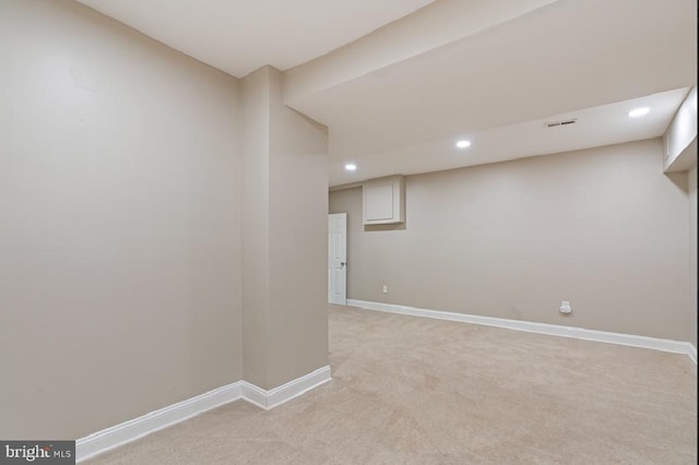 empty room featuring light carpet