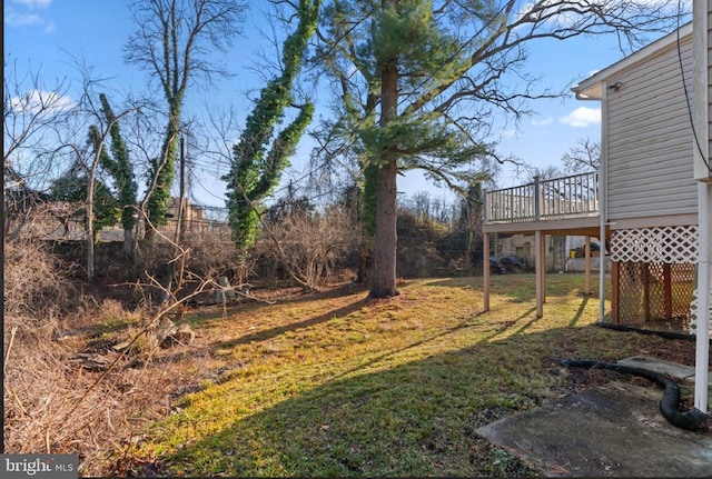 view of yard with a wooden deck