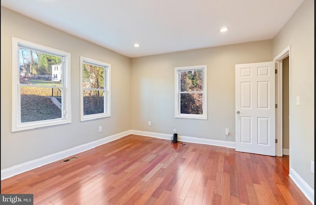 unfurnished room featuring light wood-type flooring