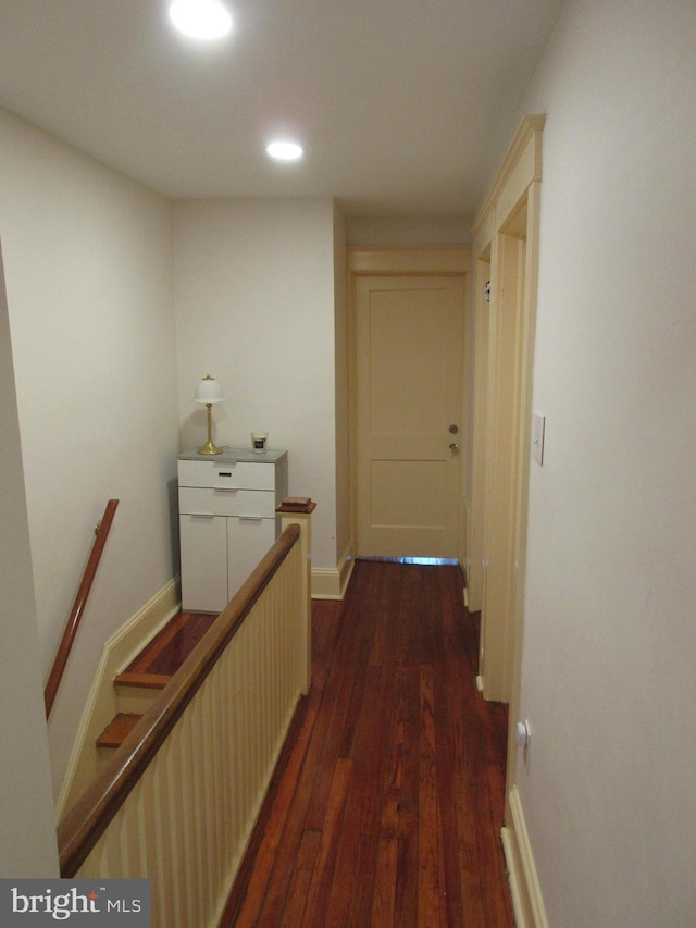 hallway featuring dark wood-type flooring