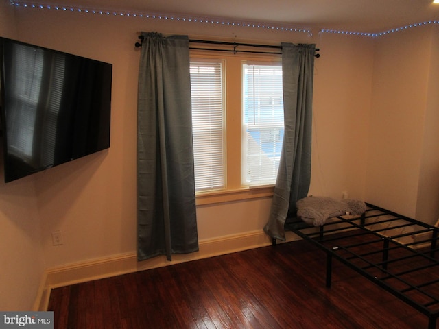 unfurnished bedroom with wood-type flooring