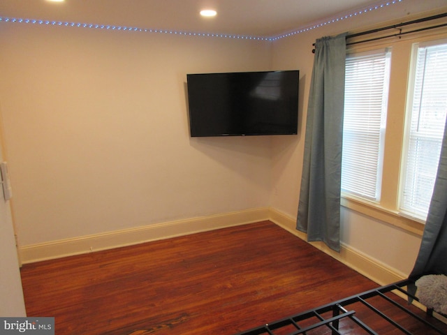 unfurnished bedroom with wood-type flooring