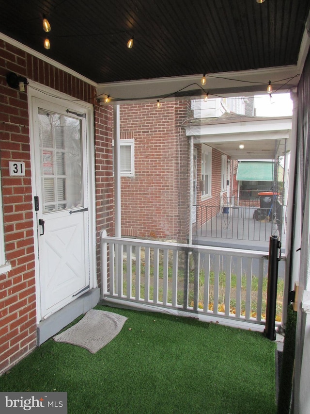 doorway to property featuring a porch