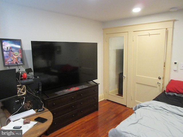 bedroom featuring dark wood-type flooring