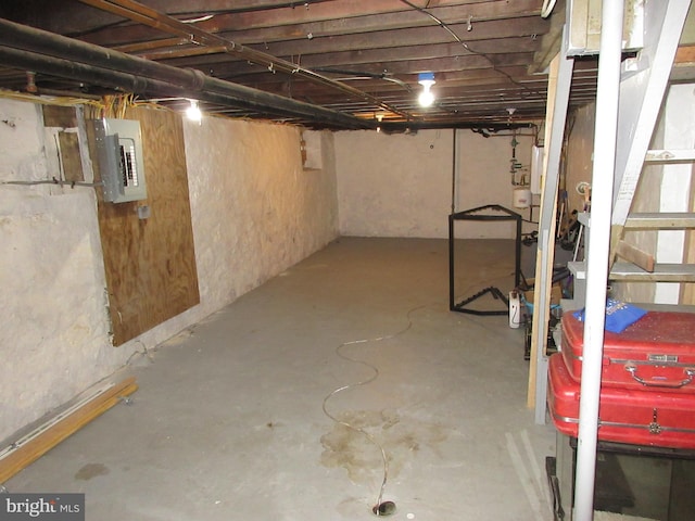 basement featuring electric panel