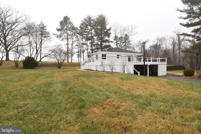 view of yard featuring a wooden deck