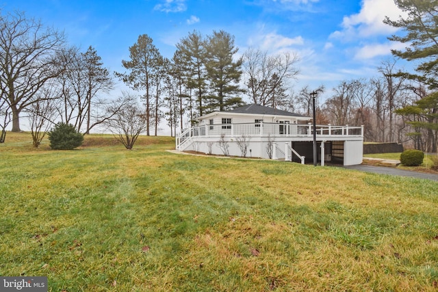 view of yard featuring a wooden deck