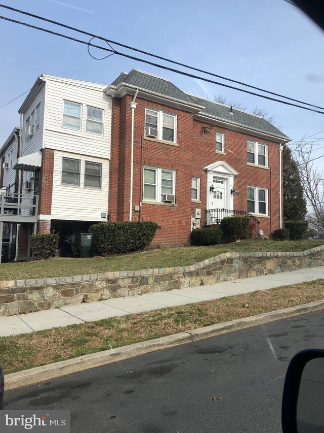 townhome / multi-family property featuring brick siding