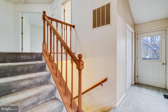 entrance foyer with light colored carpet