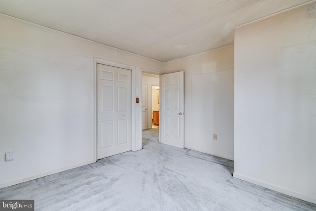 empty room featuring light colored carpet