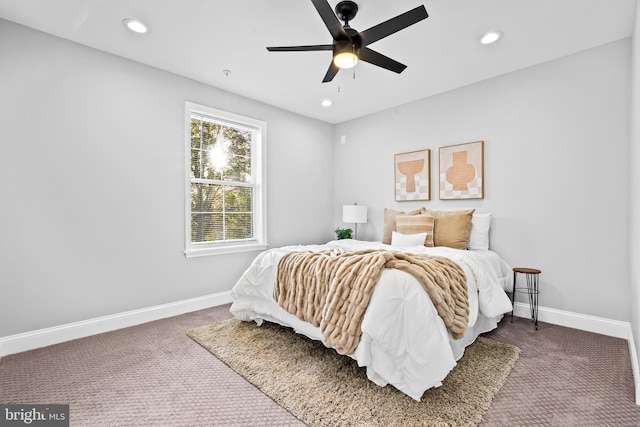 carpeted bedroom featuring ceiling fan