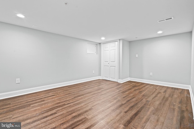 basement featuring hardwood / wood-style flooring