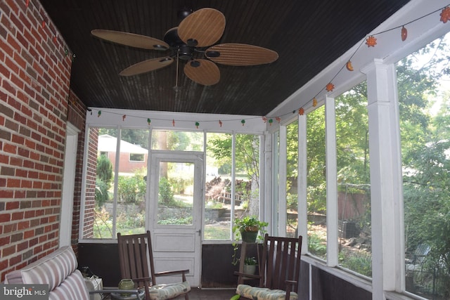 sunroom with ceiling fan and a healthy amount of sunlight