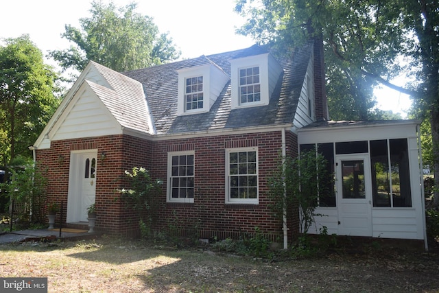 view of front of house with a sunroom