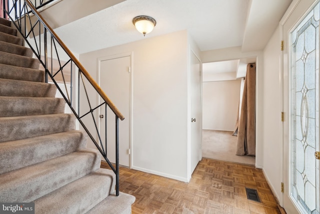 entrance foyer with light parquet floors