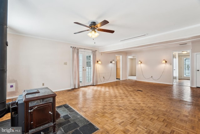 living room featuring french doors, parquet floors, a healthy amount of sunlight, and ceiling fan