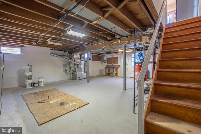 basement with heating unit and electric panel