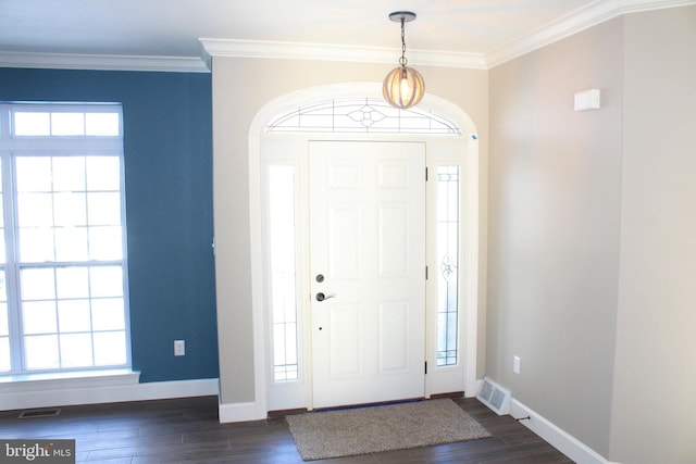 entrance foyer with ornamental molding and dark wood-type flooring