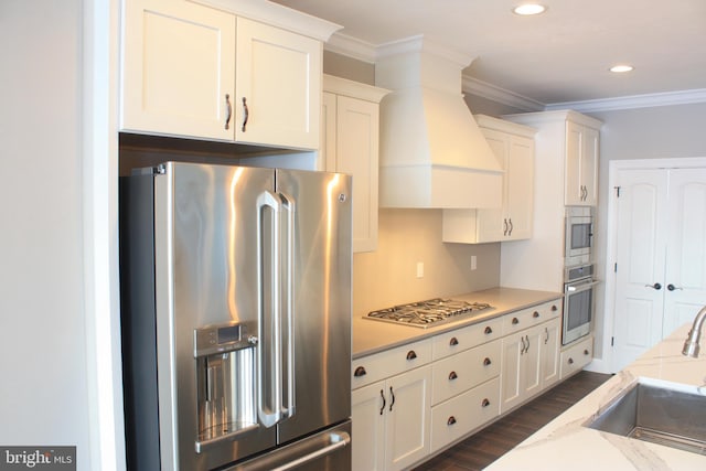 kitchen featuring sink, white cabinets, dark hardwood / wood-style floors, and appliances with stainless steel finishes