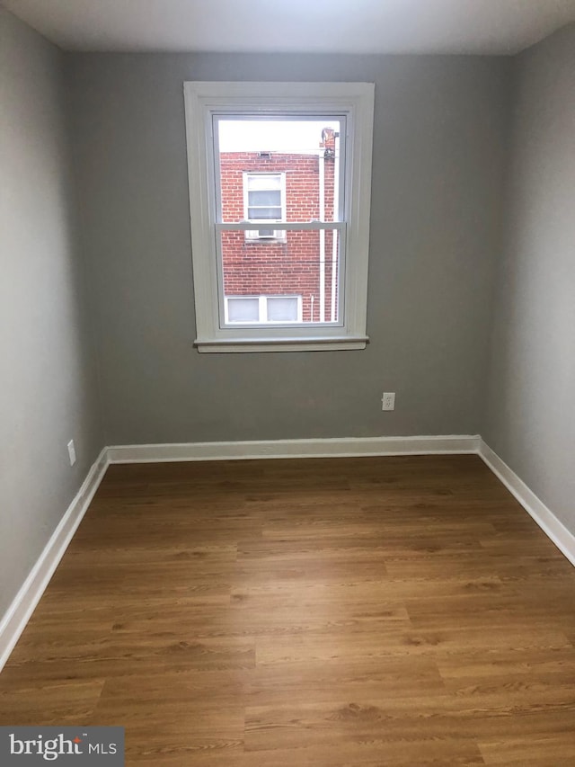 empty room featuring wood-type flooring