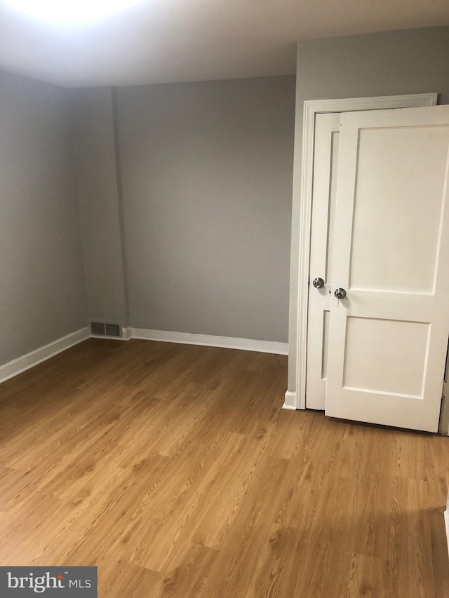 spare room featuring light hardwood / wood-style floors